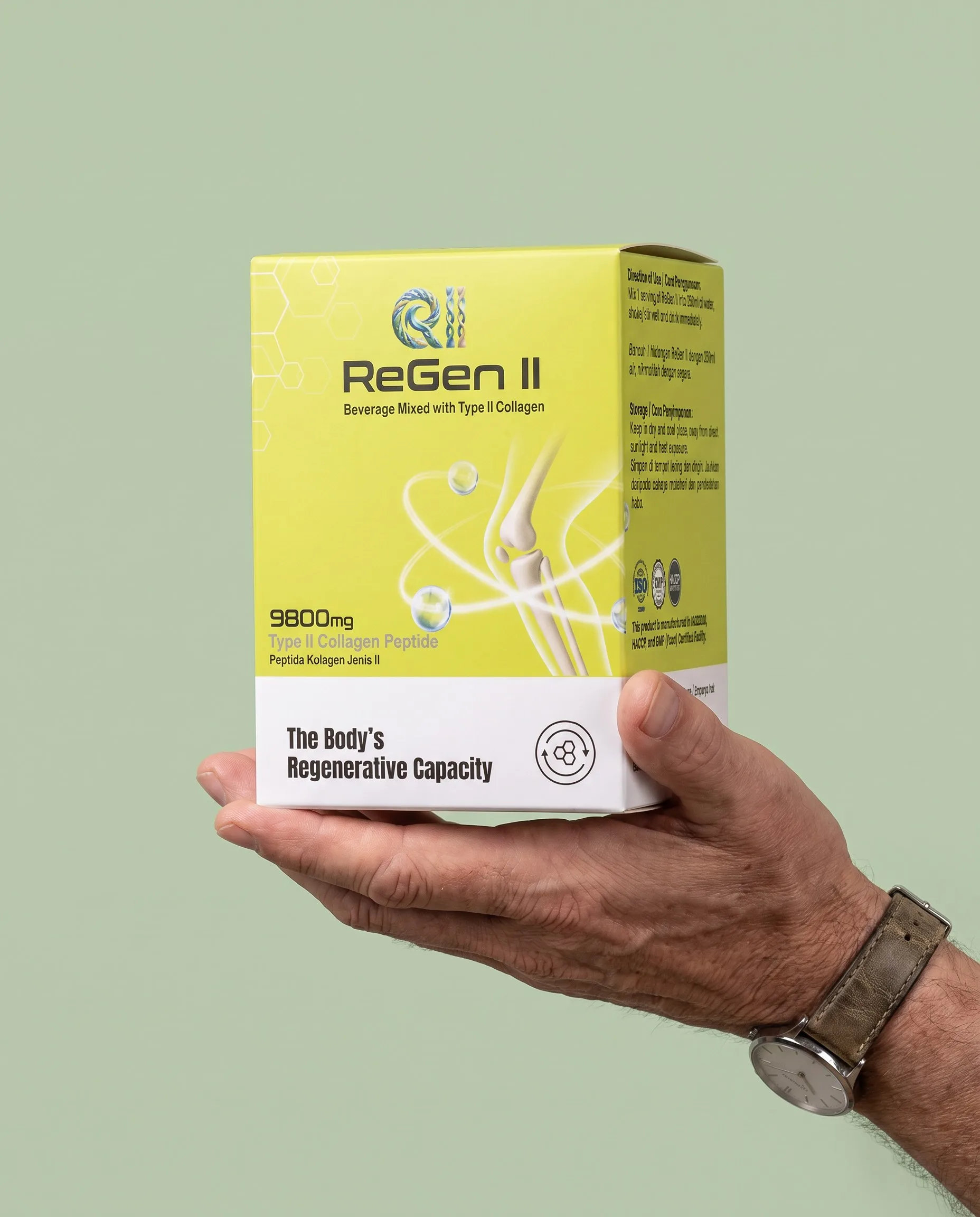 A hand holding the ReGen II box